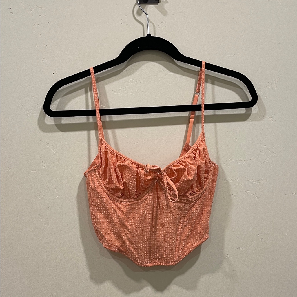 A marketplace listing photograph of a garment, the kind of asset a usage-rights clause governs